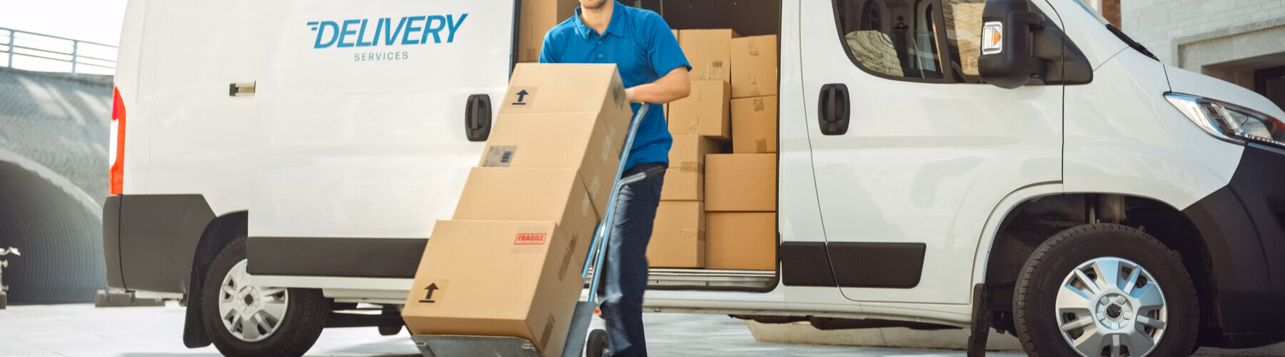 Delivery man unloading packages