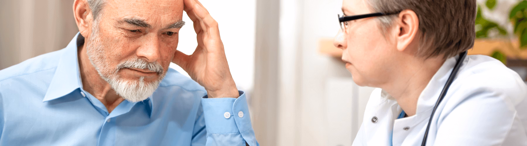A man discussing his diagnosis with his doctor