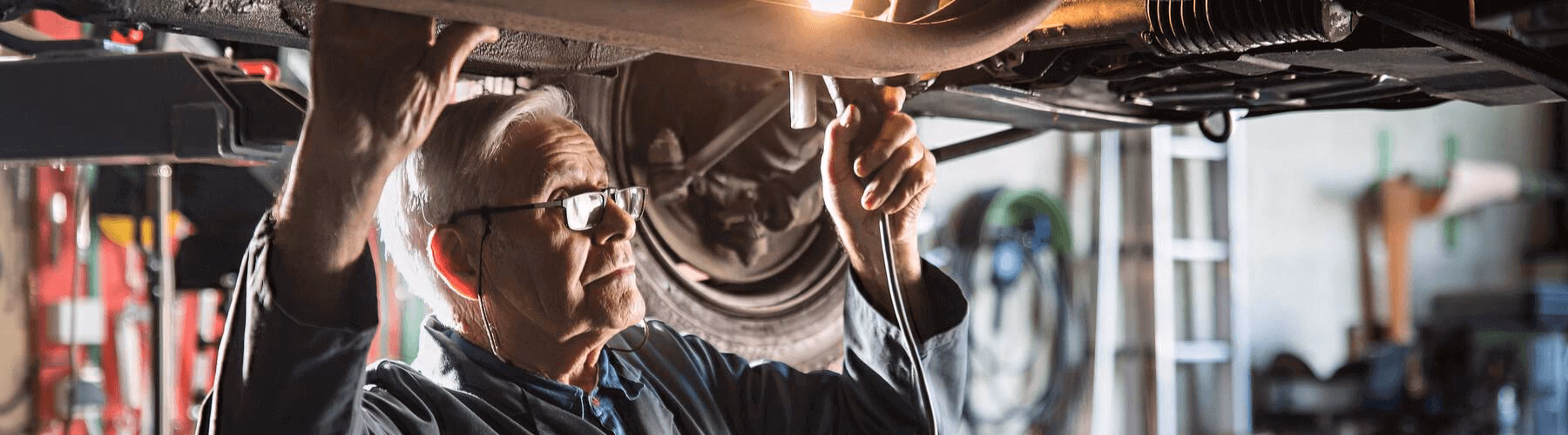 auto mechanics working on vehicle